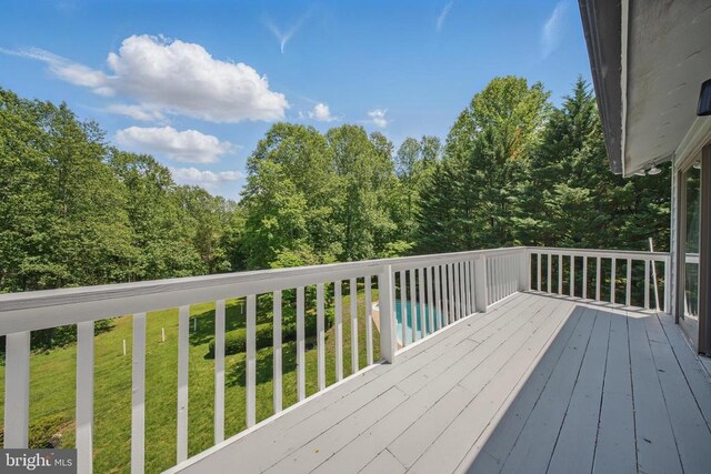  - wooden deck with a lawn