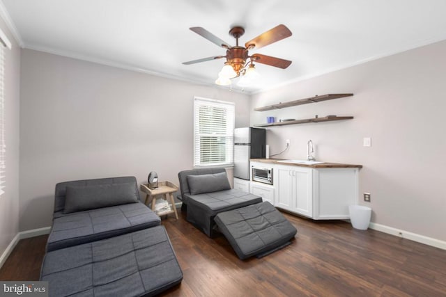 8314 Old Mill Ln, Spotsylvania, VA 22551 - bedroom featuring freestanding refrigerator, ornamental molding, dark wood-style flooring, bar with sink, and ceiling fan