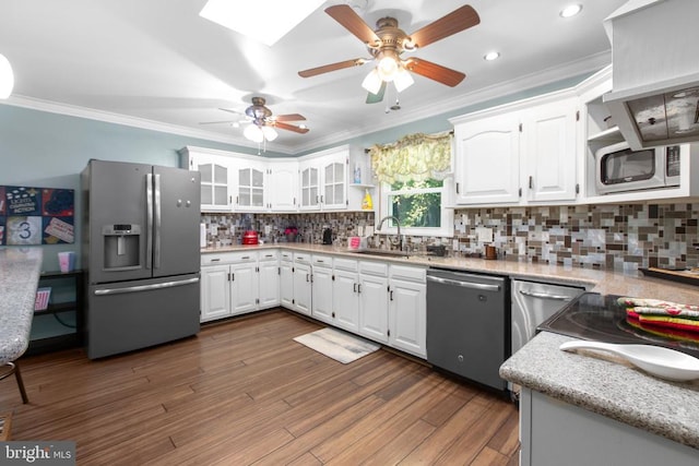 8314 Old Mill Ln, Spotsylvania, VA 22551 - kitchen with stainless steel appliances, a ceiling fan, ornamental molding, decorative backsplash, and white cabinets