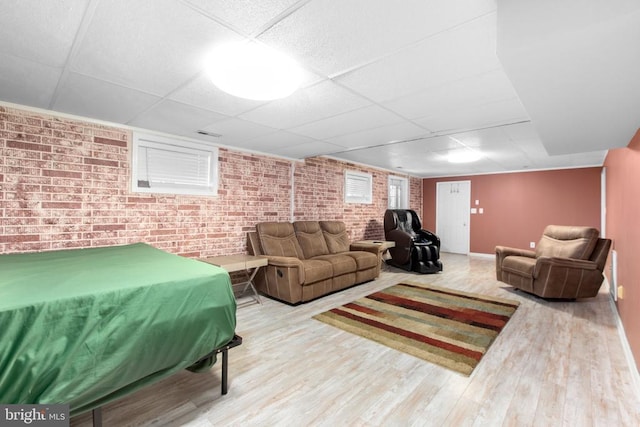 8314 Old Mill Ln, Spotsylvania, VA 22551 - living room with brick wall, a drop ceiling, and wood finished floors