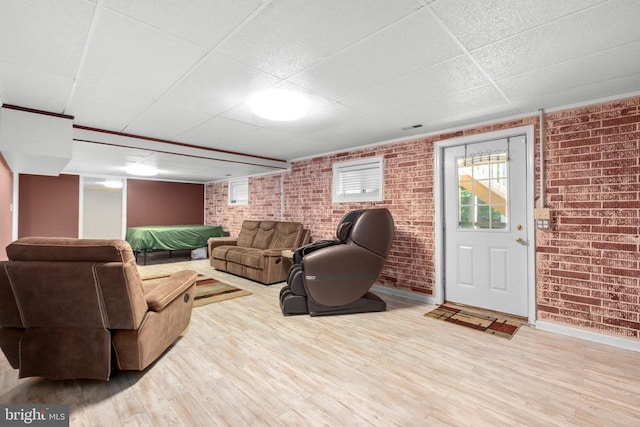 8314 Old Mill Ln, Spotsylvania, VA 22551 - living area with brick wall, a paneled ceiling, and wood finished floors