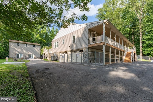 8314 Old Mill Ln, Spotsylvania, VA 22551 - view of property exterior featuring stairs, an attached garage, and driveway