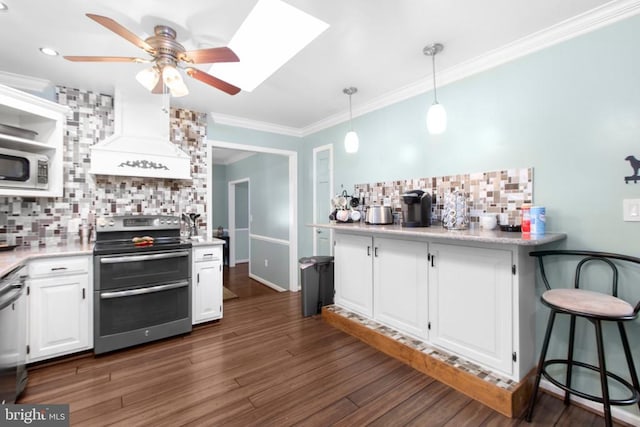 8314 Old Mill Ln, Spotsylvania, VA 22551 - kitchen featuring appliances with stainless steel finishes, backsplash, white cabinetry, ceiling fan, and custom exhaust hood
