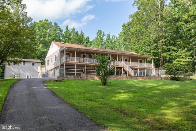 8314 Old Mill Ln, Spotsylvania, VA 22551 - view of front of property with stairway, a front yard, covered porch, and driveway