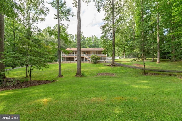 8314 Old Mill Ln, Spotsylvania, VA 22551 - view of front of home featuring a front yard, stairway, and a wooden deck