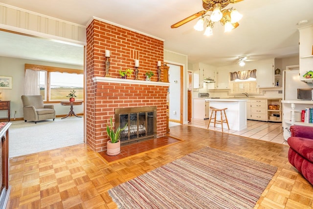 5213 Rawley Pike, Rockingham, VA 22801 - living room with a ceiling fan, a fireplace, and ornamental molding