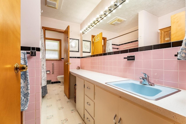 5213 Rawley Pike, Rockingham, VA 22801 - full bathroom featuring tile walls, vanity, tile patterned floors, and curtained shower