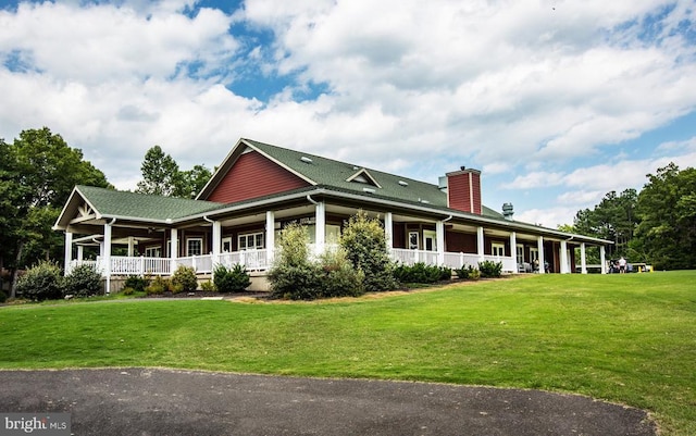 121 Jefferson Ave, Locust Grove, VA 22508 - country-style home featuring a porch, a front lawn, and a chimney