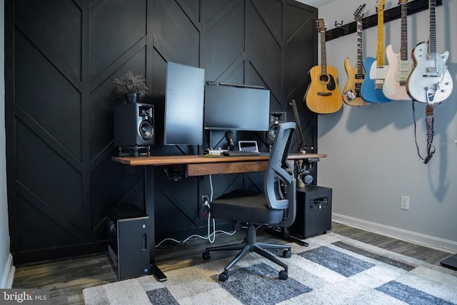 office area with wood finished floors and baseboards