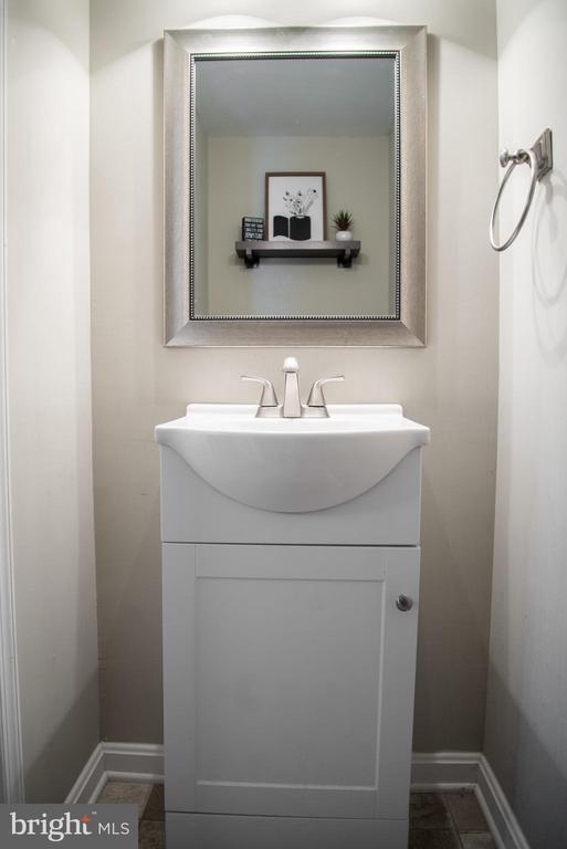 bathroom featuring vanity and baseboards