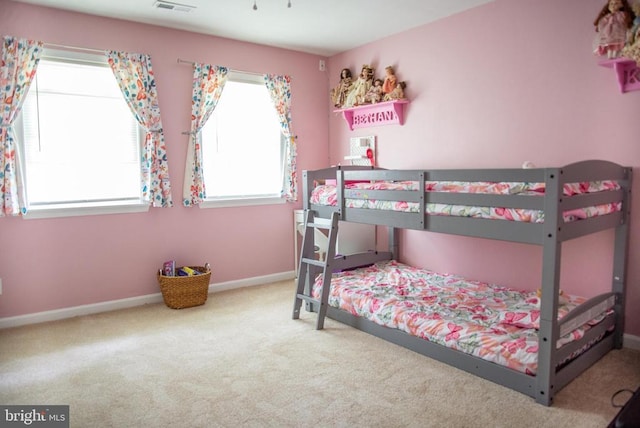 bedroom with carpet and baseboards
