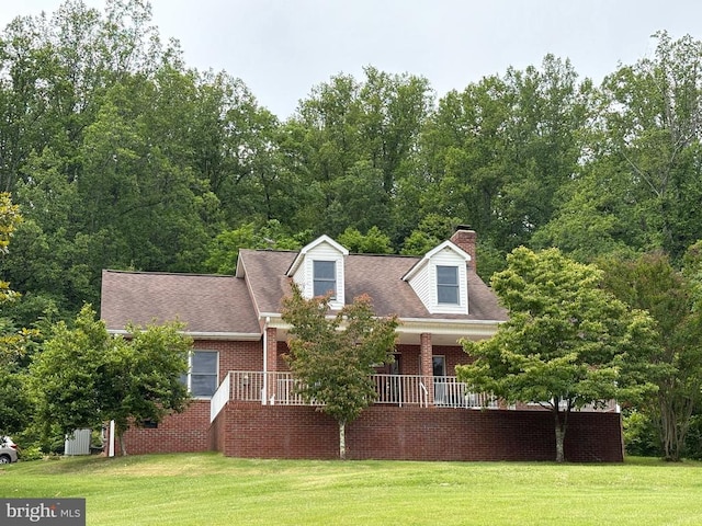 60 Mountain Breeze Ln, Syria, VA 22743 - cape cod home featuring a front yard, a chimney, brick siding, and roof with shingles