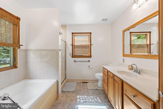 60 Mountain Breeze Ln, Syria, VA 22743 - bathroom with a bath, vanity, and a stall shower