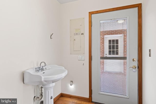 60 Mountain Breeze Ln, Syria, VA 22743 - bathroom featuring electric panel, baseboards, and wood finished floors