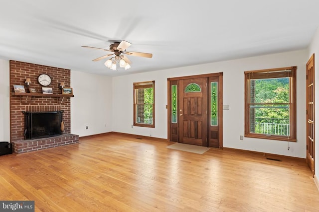 60 Mountain Breeze Ln, Syria, VA 22743 - entrance foyer featuring light wood-style floors, ceiling fan, a fireplace, and baseboards