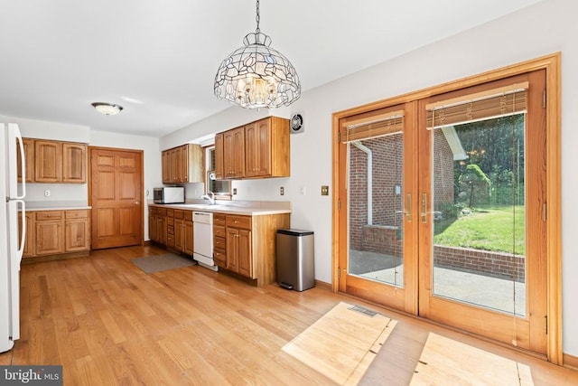60 Mountain Breeze Ln, Syria, VA 22743 - kitchen with white appliances, french doors, light countertops, a sink, and light wood-style floors