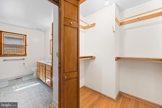 60 Mountain Breeze Ln, Syria, VA 22743 - bathroom with vanity, wood finished floors, toilet, and baseboards