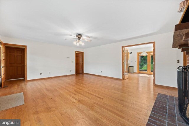 60 Mountain Breeze Ln, Syria, VA 22743 - unfurnished living room featuring light wood-style flooring and a ceiling fan