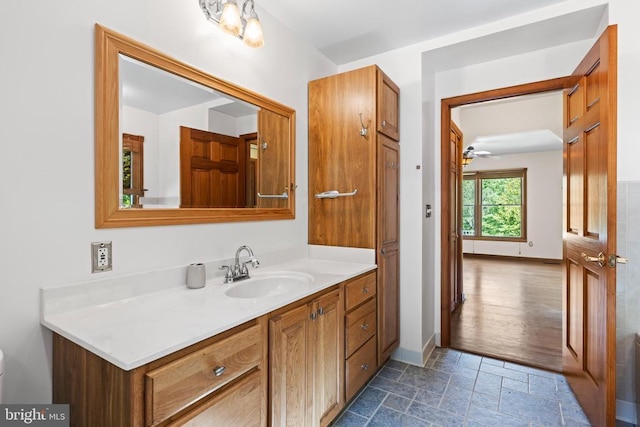 60 Mountain Breeze Ln, Syria, VA 22743 - bathroom with stone tile flooring, vanity, ceiling fan, and baseboards