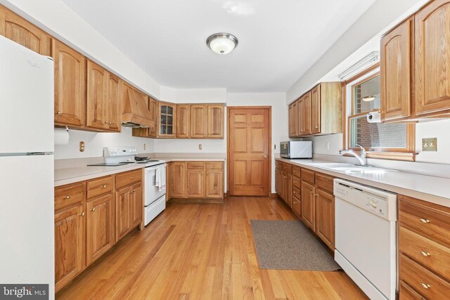 60 Mountain Breeze Ln, Syria, VA 22743 - kitchen with white appliances, light wood-style floors, custom range hood, and light countertops
