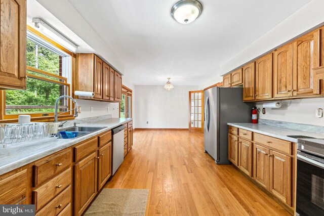 60 Mountain Breeze Ln, Syria, VA 22743 - kitchen featuring appliances with stainless steel finishes, light countertops, and brown cabinets
