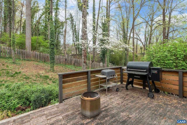 view of patio / terrace featuring area for grilling, fence, and a wooden deck