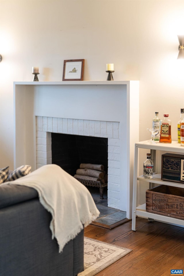 details with wood finished floors and a fireplace