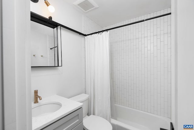 full bathroom featuring vanity, toilet, visible vents, and shower / bath combo