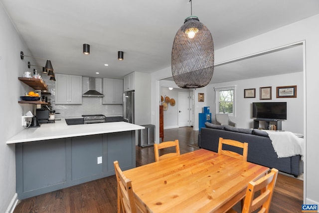dining room with baseboards, recessed lighting, and dark wood-style floors
