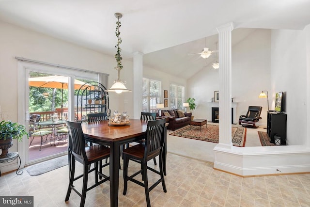 17277 Kettlebrook Lndg, Jeffersonton, VA 22724 - dining room featuring ceiling fan, decorative columns, vaulted ceiling, and a glass covered fireplace
