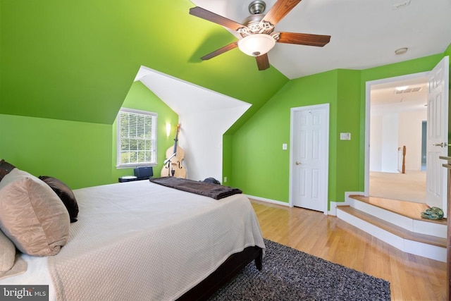 17277 Kettlebrook Lndg, Jeffersonton, VA 22724 - bedroom featuring wood finished floors, vaulted ceiling, and a ceiling fan