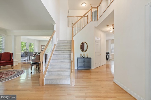17277 Kettlebrook Lndg, Jeffersonton, VA 22724 - foyer with stairway, light wood-style flooring, and a high ceiling