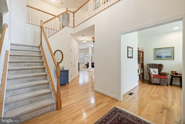 17277 Kettlebrook Lndg, Jeffersonton, VA 22724 - stairs with hardwood / wood-style floors and a towering ceiling