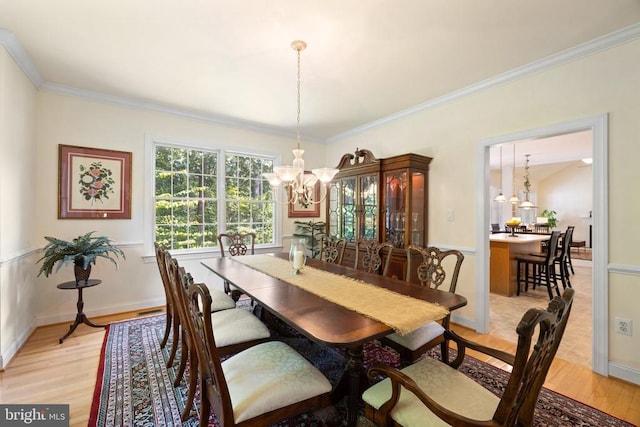 17277 Kettlebrook Lndg, Jeffersonton, VA 22724 - dining space featuring a chandelier, light wood-style floors, and ornamental molding