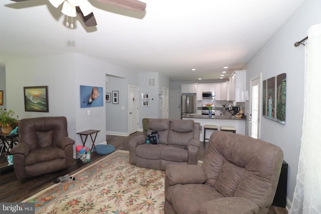 living area with ceiling fan, wood finished floors, recessed lighting, and baseboards