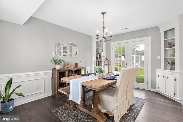 12203 Mcclain St, Fredericksburg, VA 22407 - dining area with dark wood-style flooring, french doors, wainscoting, and a notable chandelier