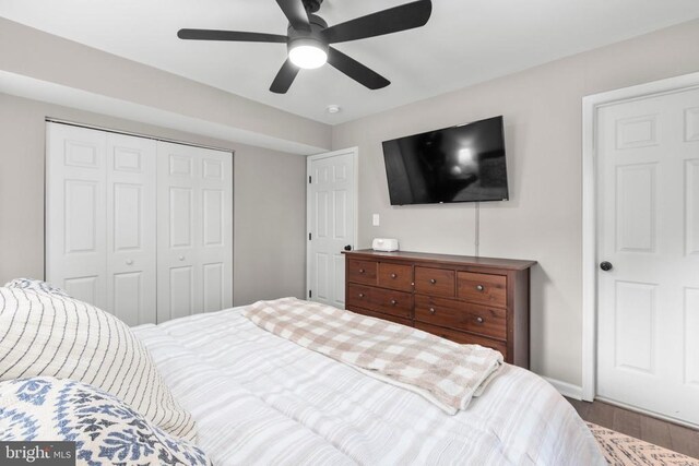 12203 Mcclain St, Fredericksburg, VA 22407 - bedroom with a closet, baseboards, wood finished floors, and a ceiling fan