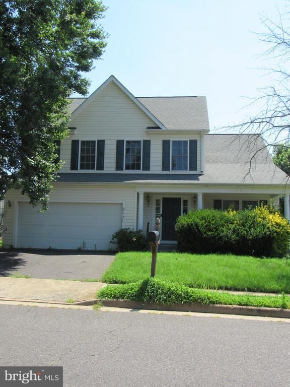 915 Virginia Ave, Culpeper, VA 22701 - view of front of property featuring an attached garage, a front yard, and asphalt driveway