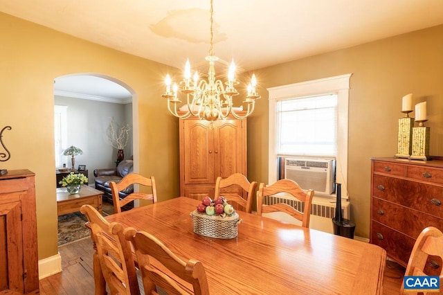 1700 Monticello Rd, Charlottesville, VA 22902 - dining area with wood finished floors, cooling unit, arched walkways, a chandelier, and ornamental molding