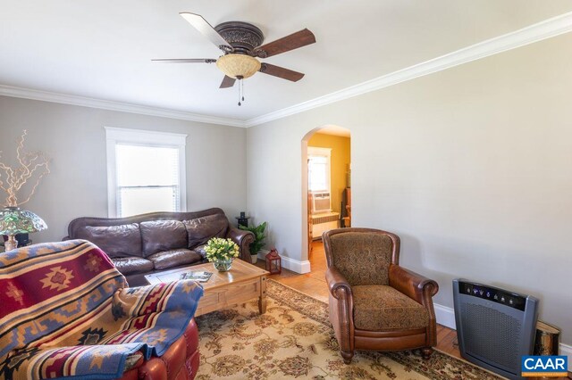 1700 Monticello Rd, Charlottesville, VA 22902 - living room featuring a ceiling fan, baseboards, crown molding, wood finished floors, and arched walkways