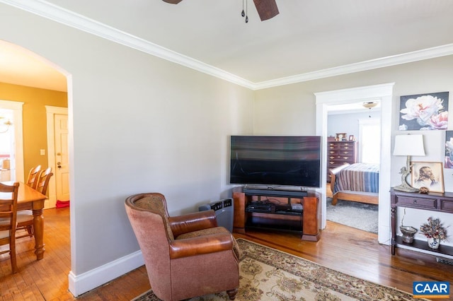 1700 Monticello Rd, Charlottesville, VA 22902 - living room featuring wood finished floors, ornamental molding, ceiling fan, arched walkways, and baseboards