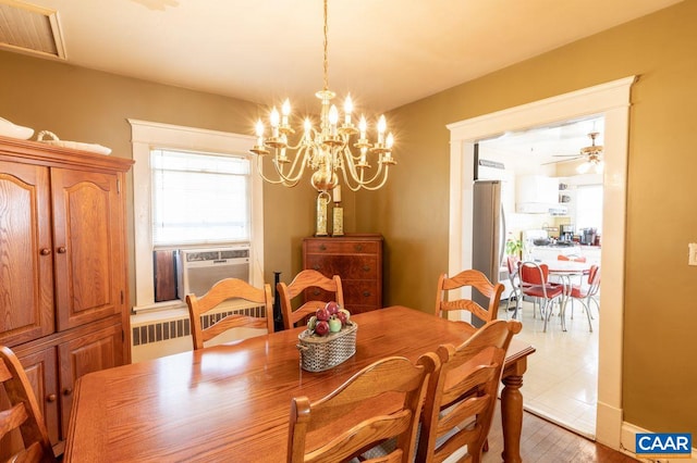 1700 Monticello Rd, Charlottesville, VA 22902 - dining area featuring an inviting chandelier, cooling unit, visible vents, and radiator heating unit