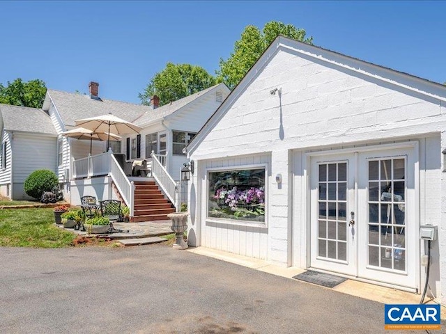 1700 Monticello Rd, Charlottesville, VA 22902 - exterior space featuring a patio area, stairway, and french doors