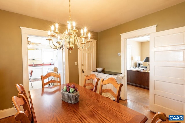 1700 Monticello Rd, Charlottesville, VA 22902 - dining area featuring a notable chandelier and wood finished floors