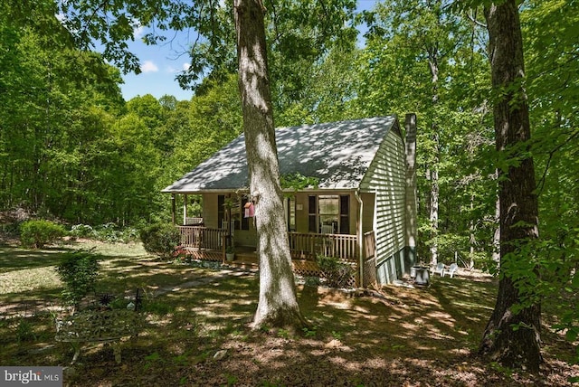 54 Courthouse Mountain Rd, Madison, VA 22727 - exterior space with a shingled roof, a porch, and a view of trees