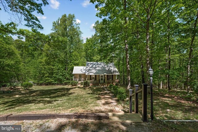 54 Courthouse Mountain Rd, Madison, VA 22727 - view of front facade featuring a porch, a front lawn, and a forest view