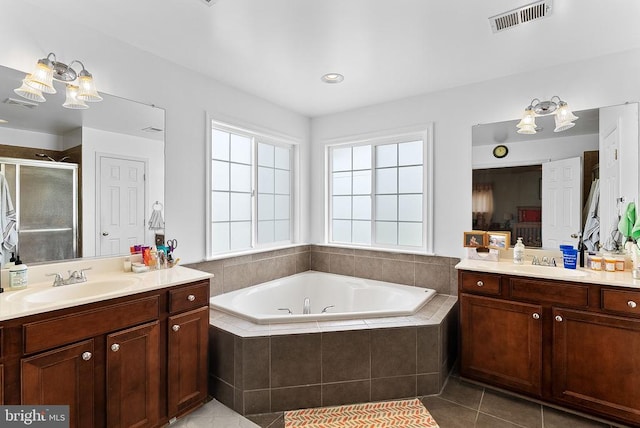 - full bathroom with tile patterned flooring, a stall shower, healthy amount of natural light, and a bath