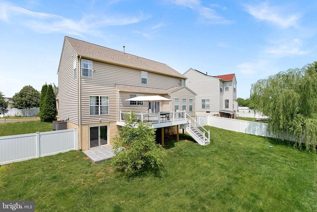  - back of property featuring a wooden deck and stairway
