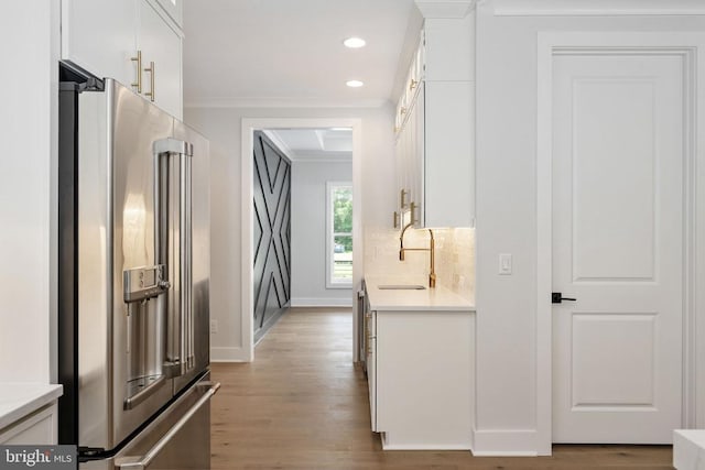 8630 Rosni Way, Fredericksburg, VA 22407 - corridor featuring ornamental molding, light wood-style floors, and recessed lighting