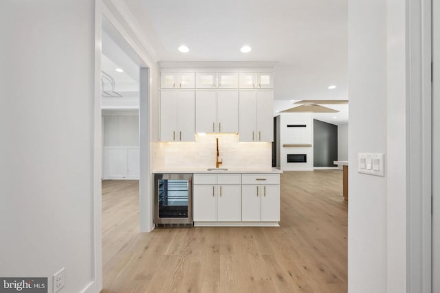 8630 Rosni Way, Fredericksburg, VA 22407 - kitchen featuring wine cooler, white cabinets, backsplash, recessed lighting, and light wood-type flooring